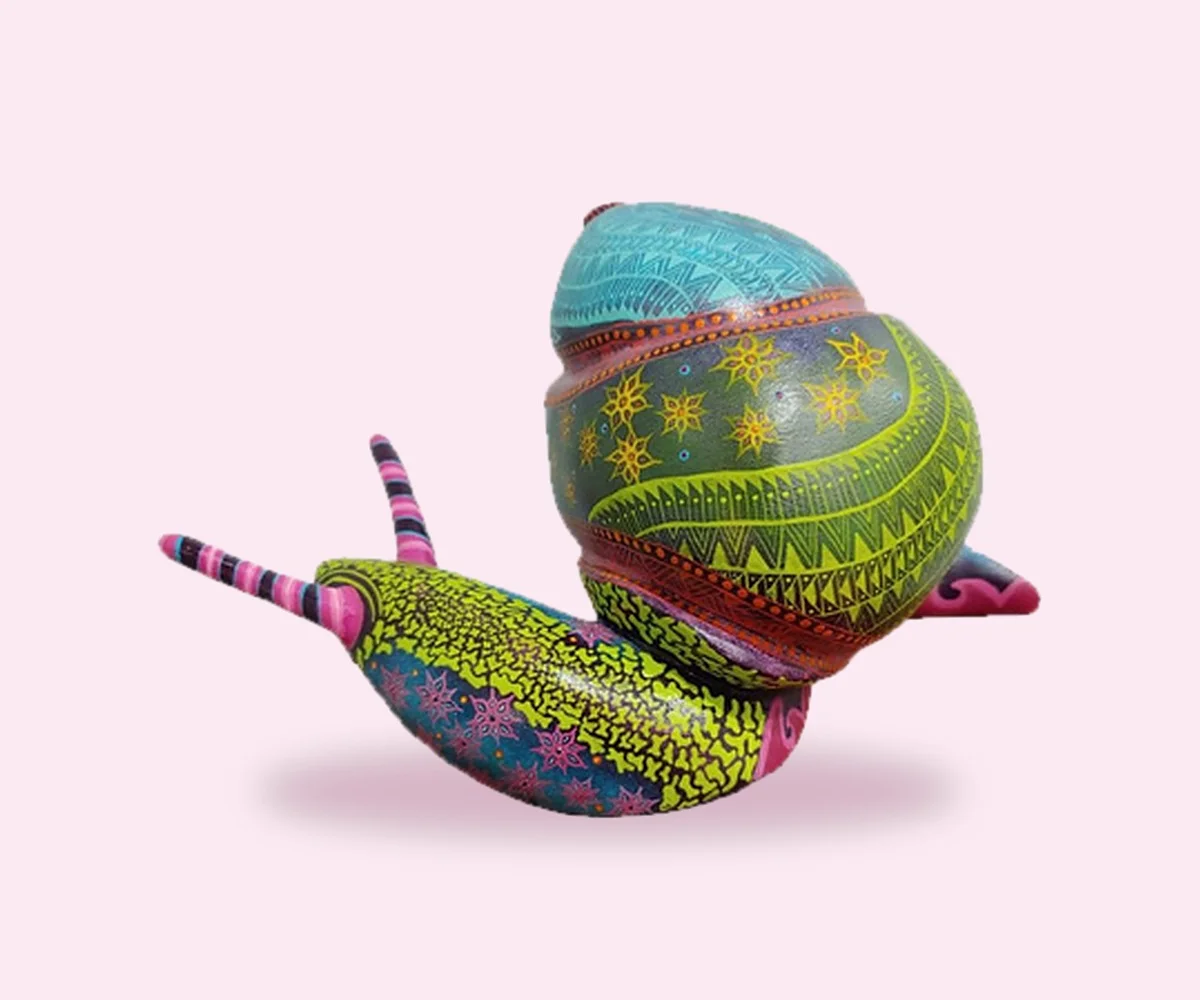 Hand-painted Mexican alebrije snail with intricate Oaxacan patterns
